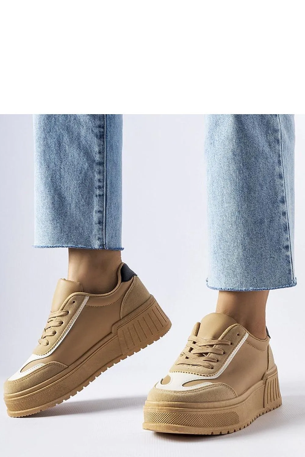 Black sneakers on a thick Seluci platform