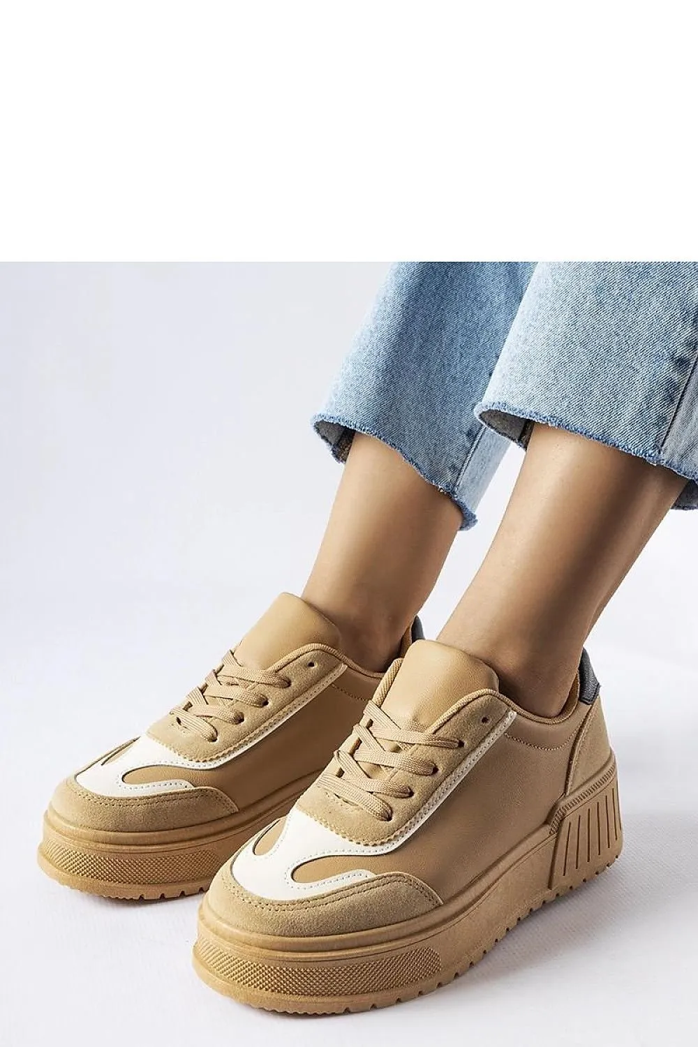 Black sneakers on a thick Seluci platform