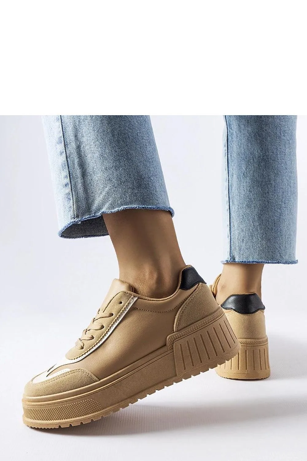 Black sneakers on a thick Seluci platform